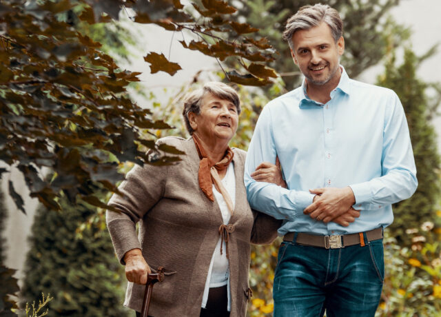 Man walking with an elderly lady